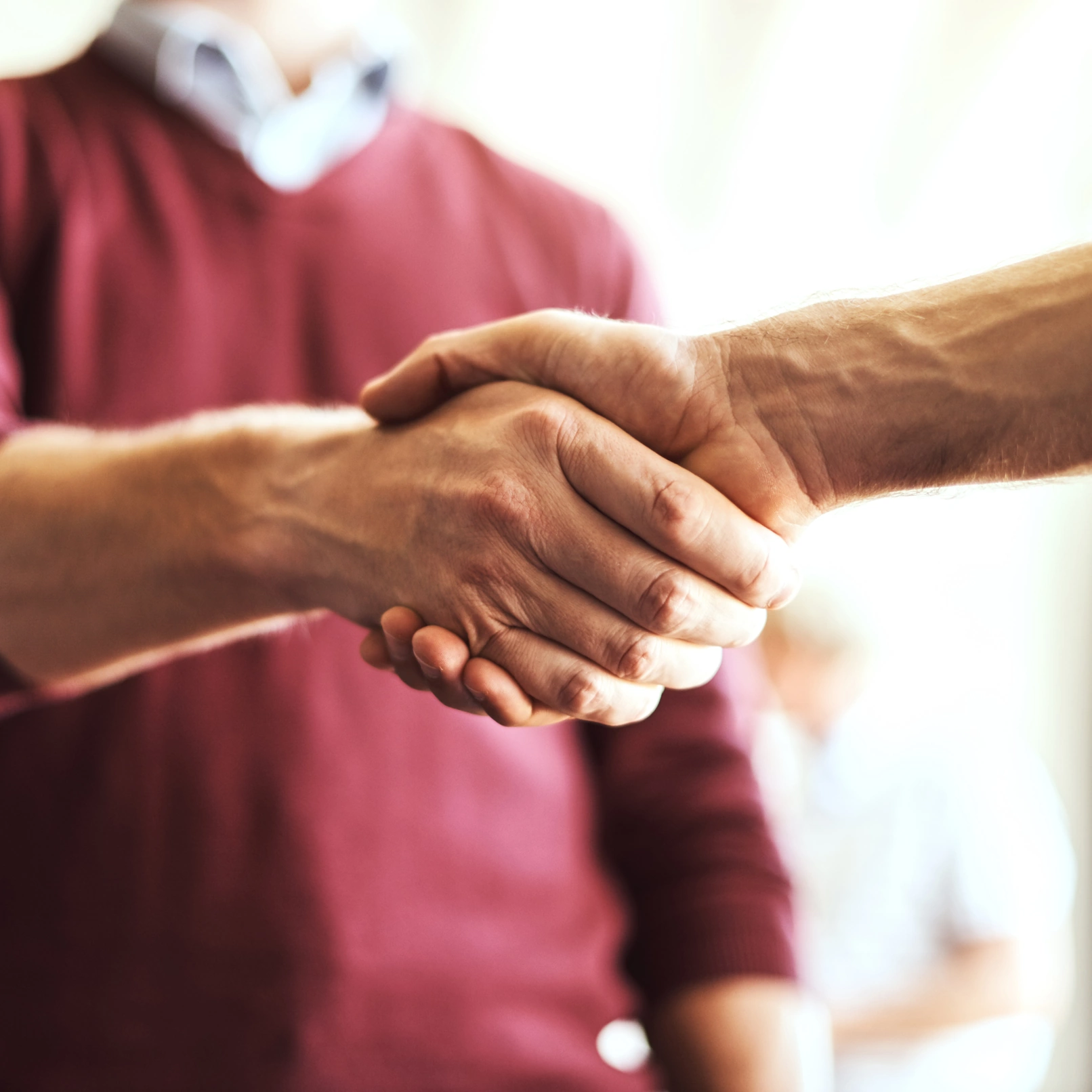 24 Hour Home Care Plano TX caretaker shaking elderly man's hand